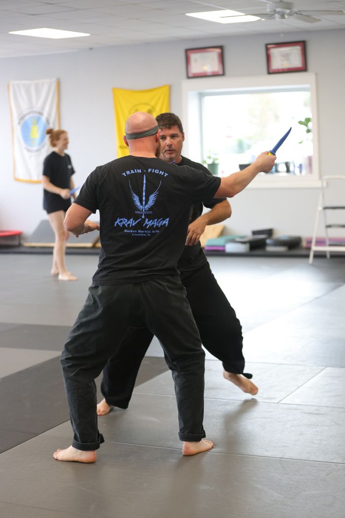 Pair practicing defense in the school training area